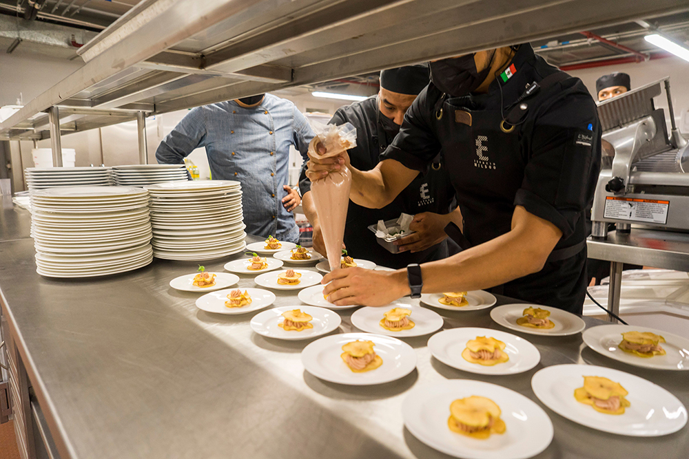 Catering manager reviewing an event order on a tablet