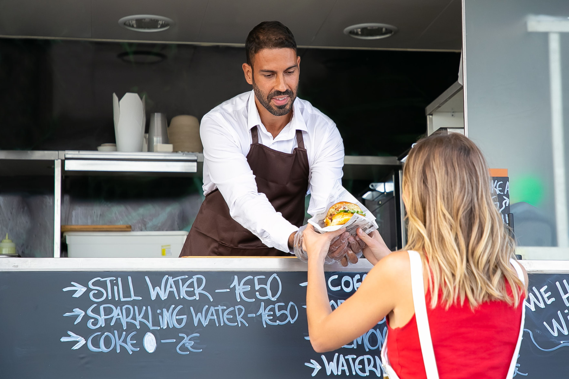 Inventory on a tablet inside a food truck kitchen